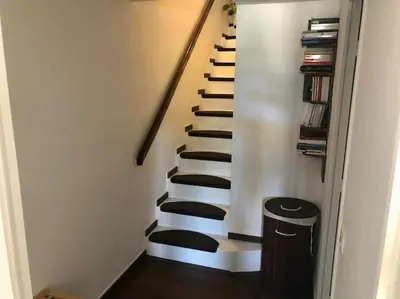 a stairway with a black and white staircase at Quiet sea view with pool in Cannes
