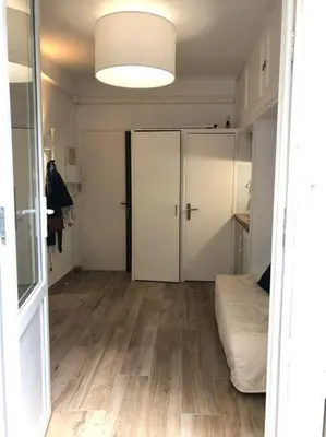 an empty room with a bed and a closet at Studio bord de mer, Croisette, Cannes in Cannes