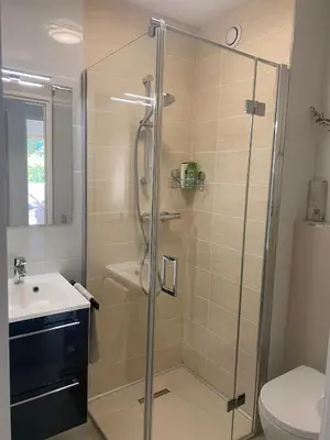 a bathroom with a shower and a sink at Elegant apartment close to Croisette and Palais de Festival with garage in Cannes