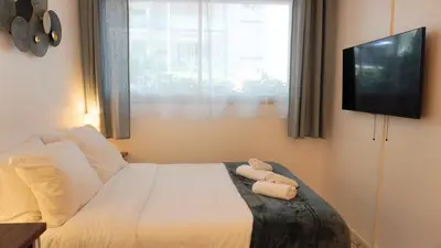 a bedroom with a bed with two towels on it at Proche Croisette, Studio moderne by Palmazur Vacances in Cannes