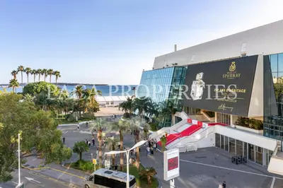 a building with a sign on the side of it at Paca Properties -401- 5 Chambres Luxe in Cannes