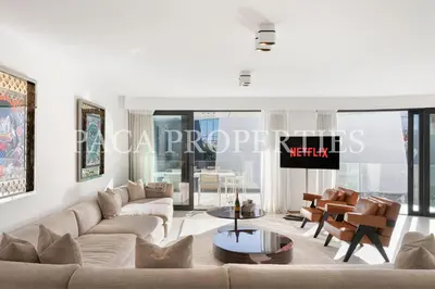 a living room with a couch and a table at Paca Properties -401- 5 Chambres Luxe in Cannes