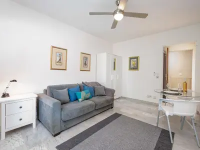 a living room with a couch and a table at Apartment Val Joli-1 by Interhome in Cannes