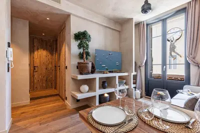 a living room with a table with glasses on it at WABISABI SUITES - BRAILLE in Cannes