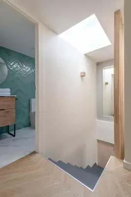 a bathroom with a sink and a mirror at Renovated bijou gem in heart of Cannes in Cannes