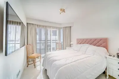 a white bedroom with a large bed and a window at PACA Properties 7C2 - appartement 3 chambres in Cannes