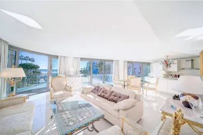 a living room with a couch and a table at PACA Properties 7C2 - appartement 3 chambres in Cannes