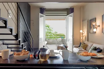 a kitchen with a table with food on it at Alma Gallia 4 pers in Cannes