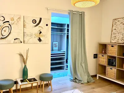 a living room with two chairs and a table at Sweett - Hotel Particulier Garden in Cannes