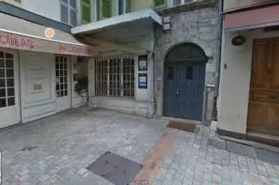 an empty parking lot with two doors on a building at MEY T2 - Superbe appartement 4 pers, 50m du vieux port et 2min à pied du palais in Cannes
