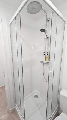 a shower with a glass door in a bathroom at PROCHE CONGRES PLAGES CLIM in Cannes