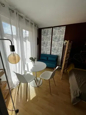 a living room with a table and two chairs at Cosy Studio - Plage et Suquet in Cannes