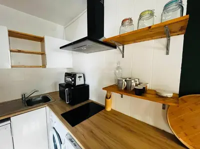 a small kitchen with a sink and a microwave at Cosy Studio - Plage et Suquet in Cannes