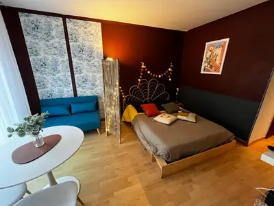 a small room with a bed and a table at Cosy Studio - Plage et Suquet in Cannes