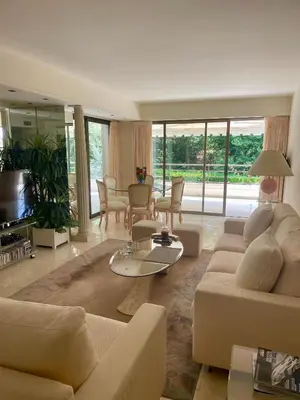 a living room with couches and a table at Luxus Wohnung nahe Croisette in Cannes