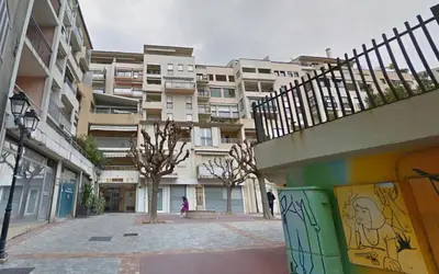 a city street with a building with graffiti on it at La Bergerie By SCLS Locations in Cannes