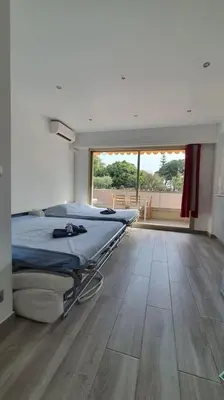 a hospital room with two beds and a large window at Beach Studio Cannes in Cannes