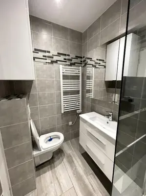 a bathroom with a toilet and a sink at Beach Studio Cannes in Cannes