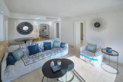 a living room with a couch and a table at REF 1174 - Apartment with Sea View in Cannes
