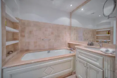 a bathroom with a tub and a sink at REF 1174 - Apartment with Sea View in Cannes