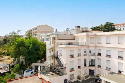 an overhead view of a white apartment building at Centre studio plage et festival in Cannes