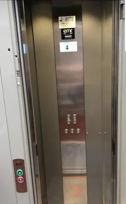 a elevator in a building with a sign on it at Appartement Palais des Festivals in Cannes