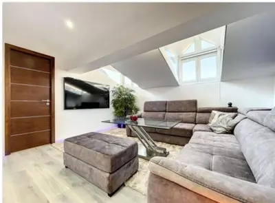 a living room with a couch and a table at Appartement Palais des Festivals in Cannes