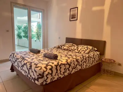 a bedroom with a bed with two pillows on it at Cannes Maria By SCLS Locations in Cannes