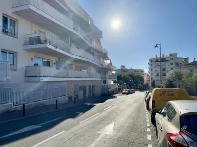 a street with cars parked on the side of a building at Cannes Maria By SCLS Locations in Cannes