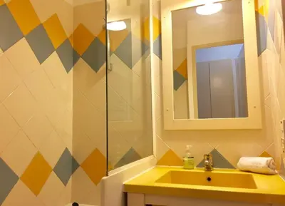 a bathroom with a sink and a mirror at Appartement 531 in Cannes