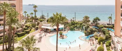 an aerial view of a resort with a pool and the ocean at Appartement 531 in Cannes