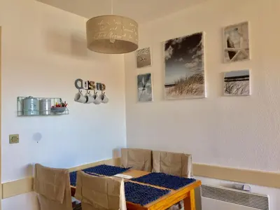 a dining room with a table and chairs at Appartement 531 in Cannes
