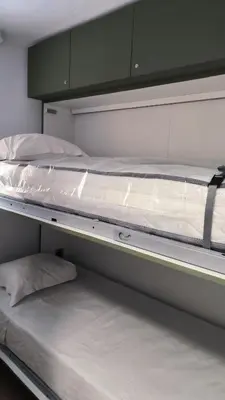 two bunk beds in a room with at Résidence Pierre et Vacance 631 in Cannes