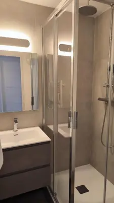 a bathroom with a shower and a sink at Résidence Pierre et Vacance 631 in Cannes