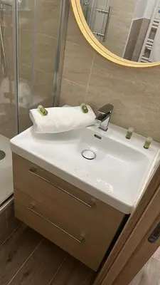 a bathroom with a white sink and a mirror at Studio cosy près de la Croisette in Cannes