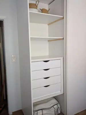 a walk in closet with white drawers at Rez de Jardin Paisible avec Parking - Entrée des Artistes in Cannes