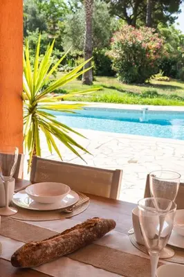 a table with a plate of food on top of it at Dream Villa 300m2 & stunning 4000m2 private garden in Cannes