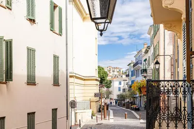 a street in a city with buildings and a balcony at Beautiful 1BR, heart of Suquet-Cannes - 5min beach in Cannes