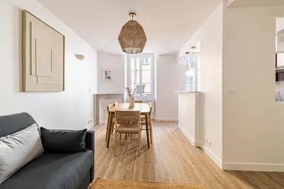 a living room with a couch and a table at Beautiful 1BR, heart of Suquet-Cannes - 5min beach in Cannes