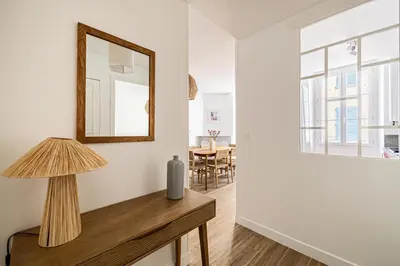 a room with a mirror and a table with a lamp at Beautiful 1BR, heart of Suquet-Cannes - 5min beach in Cannes