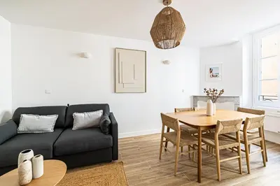 a living room with a couch and a table at Beautiful 1BR, heart of Suquet-Cannes - 5min beach in Cannes