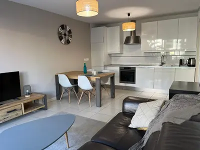 a living room with a couch and a table at Alice in Cannes