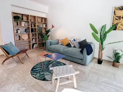 a living room with a couch and a table at 1 bedroom Velasquez, 5 mins from Croisette 244 Cannes Riviera in Cannes