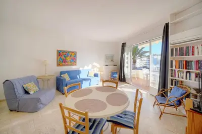 a living room with a table and chairs at FRGK 