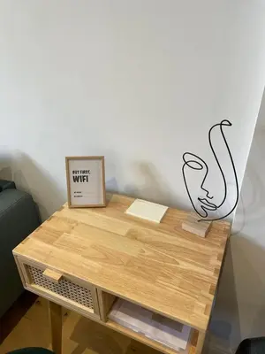 a wooden table with a sign on top of it at Le Borniol by Connexion in Cannes
