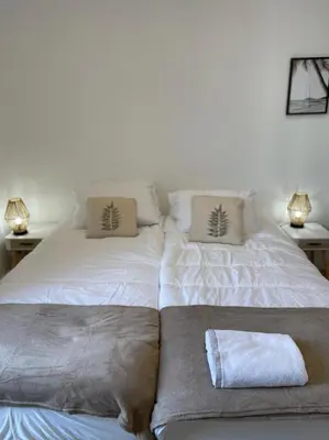 two beds sitting next to each other in a bedroom at Le Borniol by Connexion in Cannes