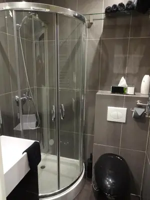 a bathroom with a shower with a toilet and a sink at Superbe Studio in Cannes 450m sea & parking in Cannes