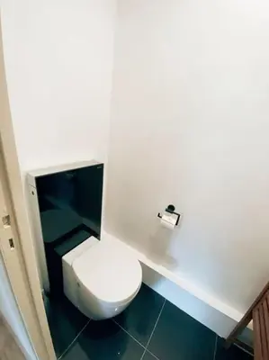 a bathroom with a white toilet in a stall at 2 bedroom apartament close to the beach in Cannes