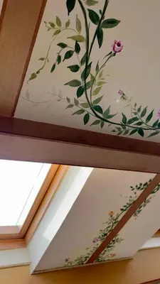 a painting on the ceiling of a window at L'échelle Rouge in Cannes