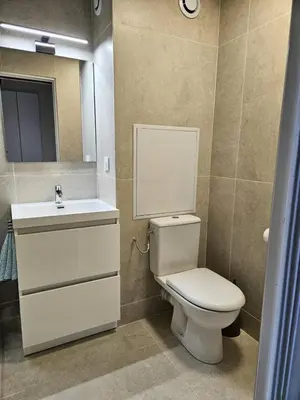 a bathroom with a toilet and a sink and a mirror at Résidence Cannes Verrerie - maeva Home - Appartement climatisé 3 pièces 4 personnes - Budget MAE-6894 in Cannes